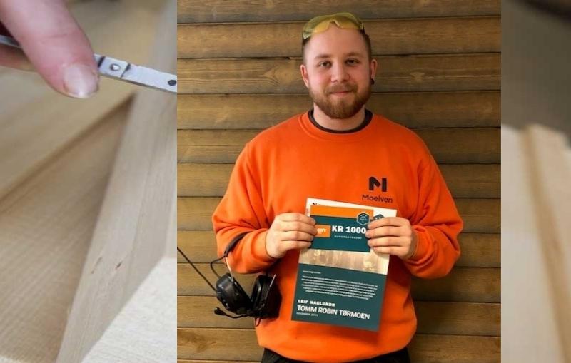 HMS-Hjälten Tomm Robin Tørmoen i orange tröja håller upp ett diplom