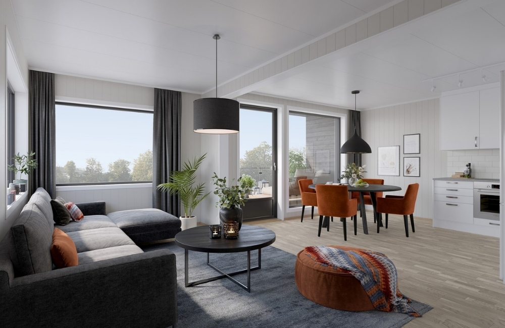 kjøkkenbord sett fra stue, mørk sofa, fargeglade kjøkkenstoler